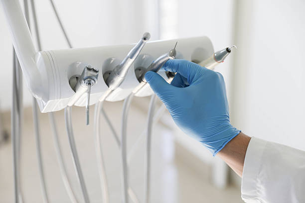 Professional Tooth Extraction technician working in Woodfin, NC